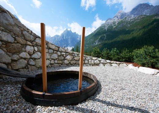 The spring water tub in the garden area with running water from the mountain stream